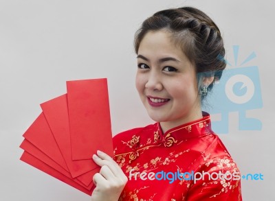 Chinese Woman Holding Red Envelopes Stock Photo