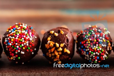 Chocolate Ball On A Wooden Stock Photo