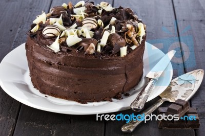 Chocolate Cake With Shovel And Cutting Knife Stock Photo