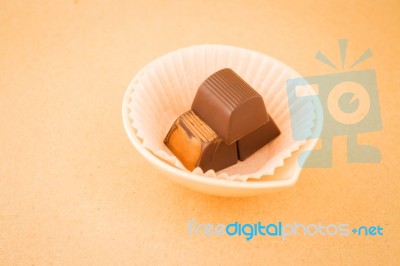 Chocolate Pieces On On Warm Vintage Background Stock Photo