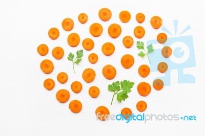 Chopped Carrot Slices And Parsley Leaves  Isolated Stock Photo