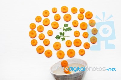 Chopped Carrot Slices  And Parsley Leaves With Bowl Stock Photo