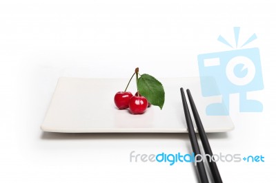 Chopstick And Cherry Stock Photo