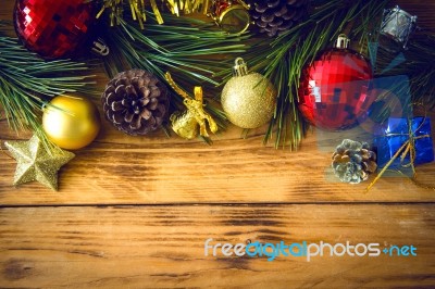 Christmas Background With Christmas Gift,red Balls, Pine Cones On Wooden Background. Christmas Vintage Style Stock Photo
