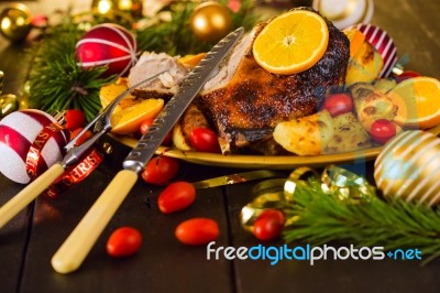 Christmas Baked Duck Served With Potatoes, Orange And Tomatoes Stock Photo