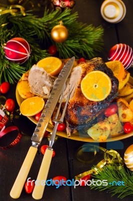 Christmas Baked Duck Served With Potatoes, Orange And Tomatoes Stock Photo