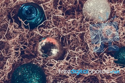 Christmas Ornaments In Hay Stock Photo
