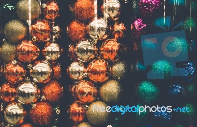 Christmas Ornaments In Tubes Background Stock Photo