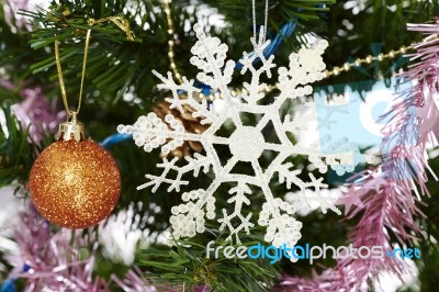 Christmas Tree Holiday Ornament Hanging From A Evergreen Branch Stock Photo