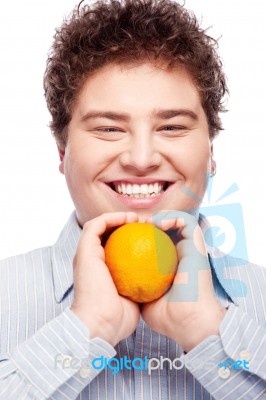 Chubby Boy And Orange Stock Photo