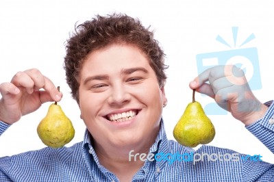 Chubby Boy And Pear Stock Photo