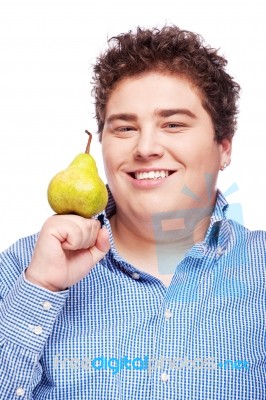 Chubby Boy And Pear Stock Photo