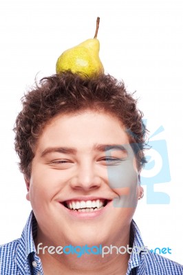 Chubby Boy And Pear Stock Photo