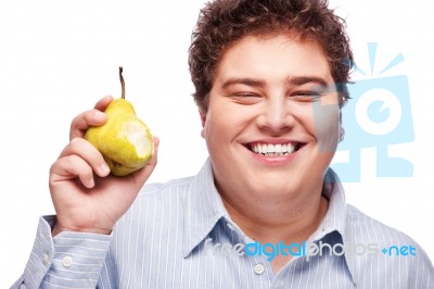 Chubby Boy And Pear Stock Photo