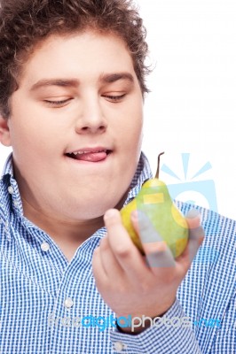 Chubby Man Holding Pear Stock Photo