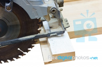 Circular Saw Cutting Wood Isolated On White Stock Photo