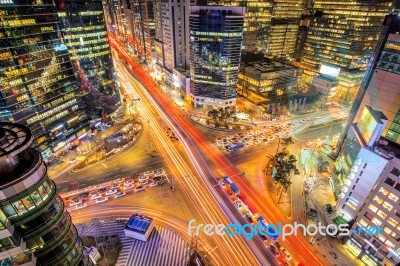 Cityscape Of South Korea. Night Traffic Speeds Through An Intersection In The Gangnam District Of Seoul,south Korea Stock Photo