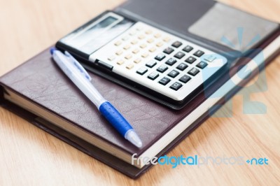 Classic Leather Notebook With Pen And Calculator Stock Photo