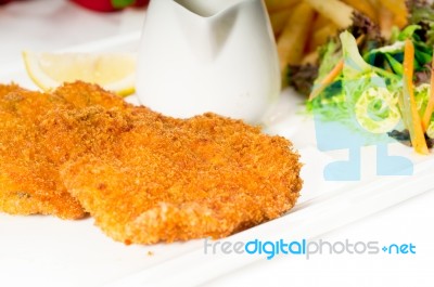 Classic Milanese Veal Cutlets And Vegetables Stock Photo