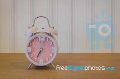 Classic Pink Alarm Clock Stock Photo