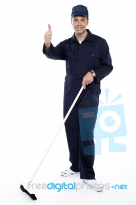 Cleaner Showing Thumb Up Gesture Stock Photo