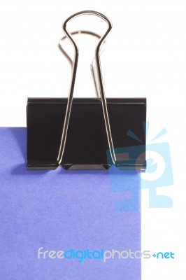 Clip And Purple Post-it Note Isolated On White Background Stock Photo