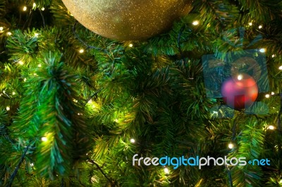 Close Up Big Yellow Glitter Ball Christmas On Tree With Wire White Light Background Stock Photo