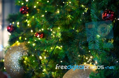 Close Up Big Yellow Glitter Ball Christmas On Tree With Wire White Light Background Stock Photo