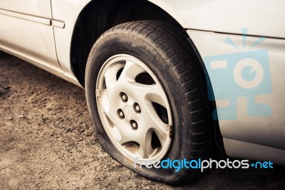 Close Up Flat Tire And Old Car On The Road Waiting For Repair Stock Photo Close Up Flat Tire And Old Car On The Road Waiting For Repair Stock Photo