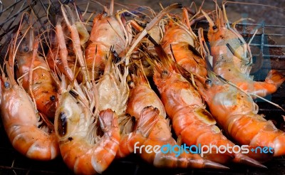 Close Up Grilled Shrimp With Flames Stock Photo