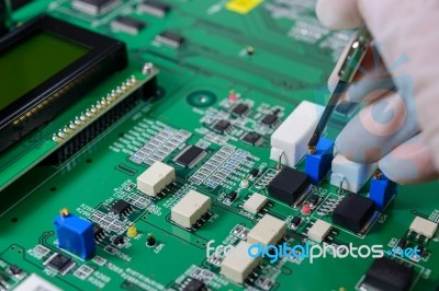 Close-up Of A Male Technician Repairing Electronic Board Stock Photo
