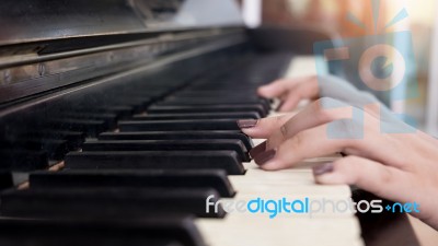 Close-up Of A Music Performer's Hand Playing The Piano Stock Photo