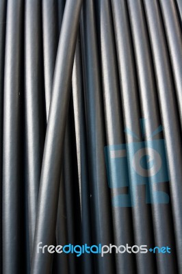 Close-up Of Black Electricity Cable Verticla On A Spool Stock Photo