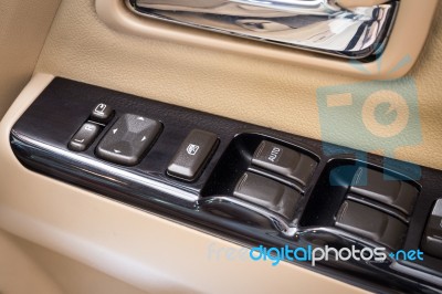 Close Up Of Controls Button Switch On The Door. Interior Detail In Luxury Modern Car Stock Photo