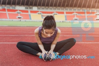 Close Up Of Fit Body Of Sport Girl She Warming Up Before Running… Stock Photo