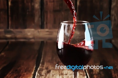 Close Up Of Pouring Wine In Glass Stock Photo