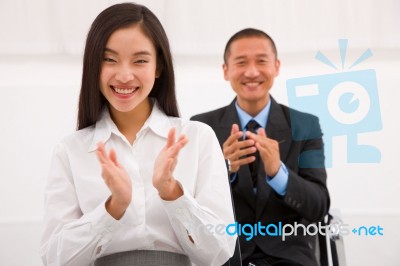 Close-up Of Smiling Businesspeople Clapping Stock Photo