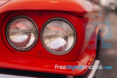 Close-up Of The Front Of The Red Vintage Car Stock Photo
