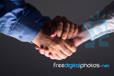 Close Up Of Two Male Hands Shaking Stock Photo