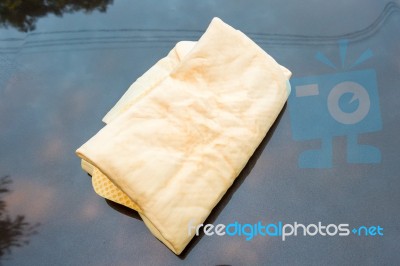 Close Up Of Yellow Chamois (microfiber Towel) On Car Stock Photo