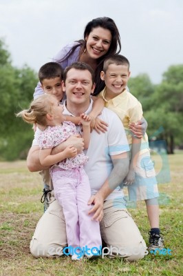 Close Up Shot Of Cheerful Family Posing Together Stock Photo