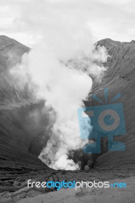 Close-up Volcano Crater Erupting Black And White Stock Photo