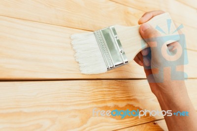 Closeup Hand Use Brush Paint Clear Lacquer On Wood Surface Stock Photo
