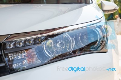 Closeup Headlights Of Modern White Car With Led Daylight Running Lights Stock Photo
