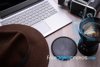 Closeup Of A Wooden Table With Laptop Stock Photo