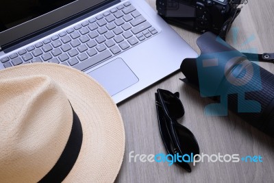 Closeup Of A Wooden Table With Laptop Stock Photo