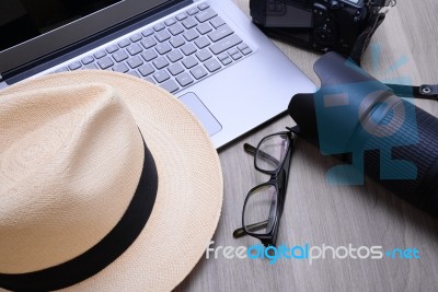 Closeup Of A Wooden Table With Laptop Stock Photo