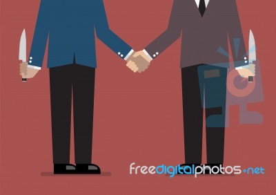 Closeup Of Business Handshake With A Knife Hidden Behind Stock Image