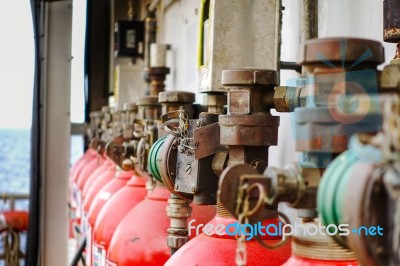 Closeup Of Head And Valves Of Fire Extinguishers Arrange Stock Photo