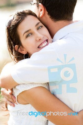 Closeup Portrait Of A Beautiful Couple Hugging Stock Photo